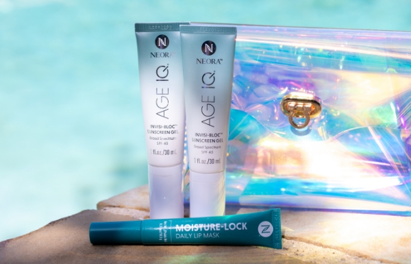 The Summer Skin Essentials Set shown in front of a refreshing blue pool. 